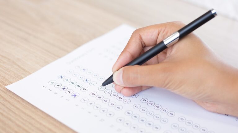 closeup-person-filling-out-questionary-form
